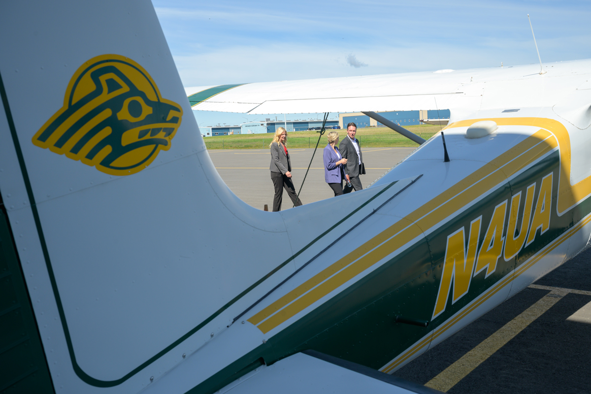 Atlas Air CEO Michael Steen tours the flight line with UAA Piloting and Aviation Management professor Cassie Martin and  Chief Strategic Gifts Officer Jennifer Motes as he visits UAA's Aviation Technology Center and announces that Atlas Air will award $50,000 in scholarships to the University of Alaska Anchorage.